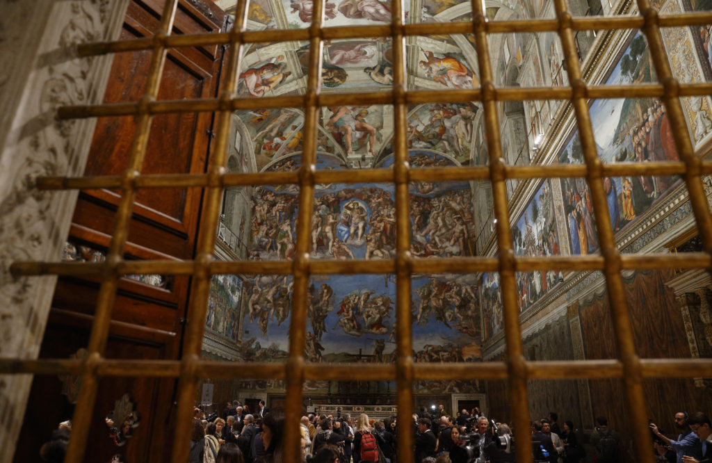 The Sistine Chapel is illuminated with new LED lighting at the Vatican Oct. 29. The new lighting system was donated by Osram, a German lighting company. A new air conditioning system also was donated and installed by the U.S.-based Carrier company. The chapel now is cooler and better lit with the new systems, which will help preserve Michelangelo Buonarroti's masterpiece. (CNS photo/Paul Haring) 