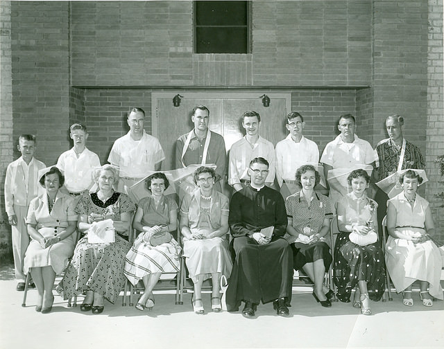 Msgr. McMahon poses in this circa 1956 photo with Catholics outside of St. Cyril in Tucson. He served there for nine years and came to the Valley in 1959 where he remained until his death Nov. 5. (photo courtesy of Diocese of Phoenix Office of Archives)