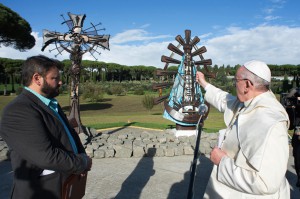 Pope Francis blesses two new statues by Argentine artist Alejandro Marmo, left, at the papal villa at Castel Gandolfo, Italy, Nov. 16. The statues are iron sculptures of the crucified Christ and Our Lady of Lujan. (CNS photo/L'Osservatore Romano) 