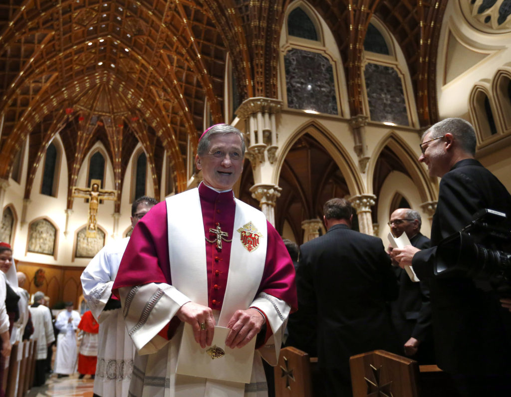 Archbishop Blase J. Cupich leaves Holy Name Cathedral Nov. 17 after a welcoming ceremony a day ahead of his installation to head the Archdiocese of Chicago. Archbishop Cupich is Pope Francis' first major appointment for the hierarchy of the U.S. Catholic Church. (CNS photo/Jeff Haynes, Reuters)