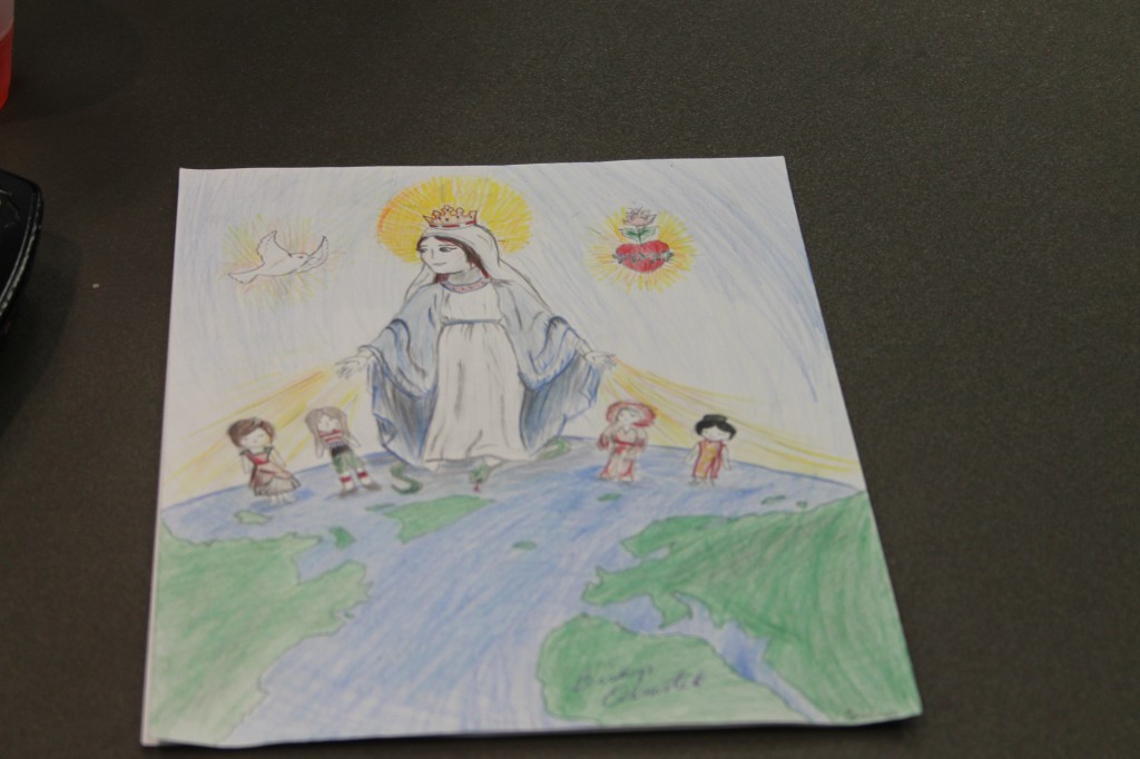 All 3,000 entries submitted to the 2014 poster contest through the Arizona Rosary Celebration depicted how Mary, the Immaculate Conception affects the artist's life. The one pictured here is by ___ of St. Vincent de Paul School (Ambria Hammel/CATHOLIC SUN) 