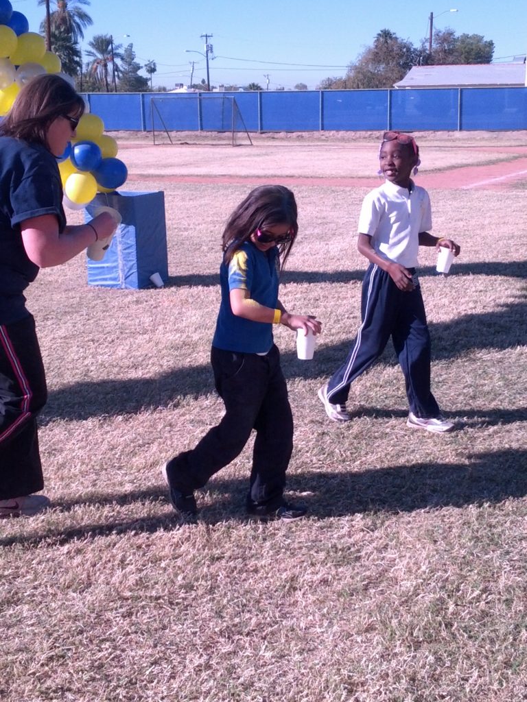 St. Gregory students get a fresh dusting of colored powder during the school's Jog-a-thon Nov. 25. (courtesy photo)