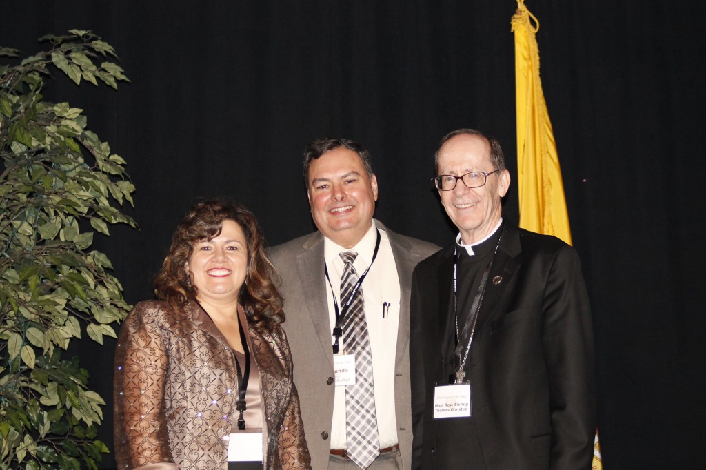 Josefina and Fernando Camou are the 2014 Charity and Development Appeal co-chairs, seen here alongside Bishop Thomas J. Olmsted at the Nov. 19 Miter Dinner. Some 500 people from throughout the Phoenix Diocese attended the dinner held at the Phoenix Convention Center. (Joyce Coronel/CATHOLIC SUN)