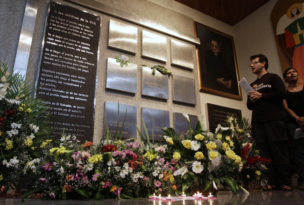 A man and woman sing and pray in a chapel in San Salvador during a Nov. 14 service to commemorate the 21st anniversary of the killing of six Jesuits during El Salvador's civil war. The priests, their housekeeper and her daughter were killed at Central American University Nov. 16, 1989, by members of an army unit during a military offensive. (CNS photo/Luis Galdamez, Reuters) 