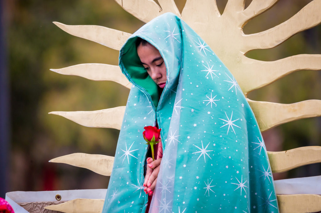 Pictured here is a young lady representing Our Lady of Guadalupe, as she appeared to Juan Diego. Thousands of people were drawn to the streets of downtown Phoenix Dec. 6 in our outpouring of love for Our Lady of Guadalupe at the annual Honor Your Mother event. (Billy Hardiman/CATHOLIC SUN)