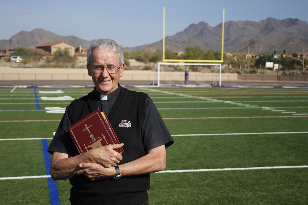 Spiritan Father Phil Evanstock, pictured here Dec. 10 at Notre Dame Preparatory, is a big football fan. He’s on Saints’ sidelines, in Arizona Cardinals’ seats and behind the altar offering Masses for visiting NFL teams. (Ambria Hammel/CATHOLIC SUN)
