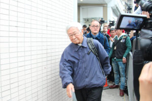 Cardinal Joseph Zen Ze-kiun, retired bishop of Hong Kong, leaves the police station after surrendering to police Dec. 3. Cardinal Zen asked faithful to pray for the democracy in the city after he stayed at the police station for an hour, documenting his involvement in the Occupy Central movement. (CNS photo/Francis Wong)