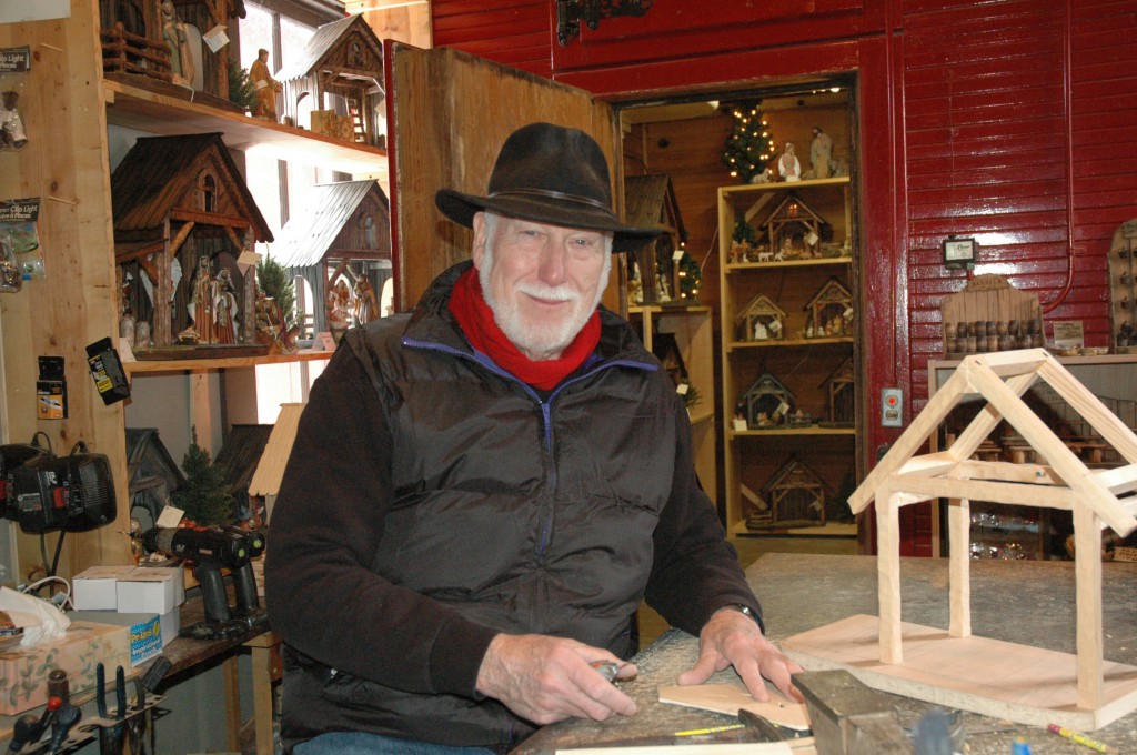 Indiana craftsman Ed Kirschner works on a Nativity stable he is making in his small shop in Oldensburg. Kirschner says his creations help him reflect on his faith and share stories about Christmases from his past. (CNS photo/John Shaugnessy, The Criterion)