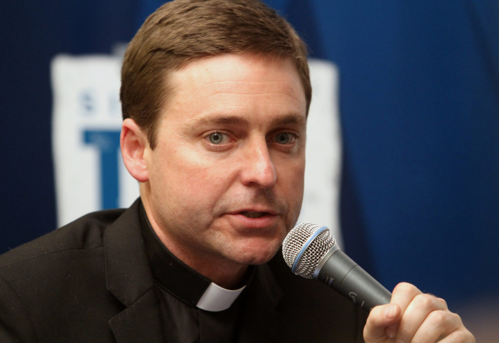 Father Jonathan Morris, program director and talk-show host for the Catholic Channel on the Sirius XM satellite radio platform, has left the station. He is seen during a broadcast at the satellite radio station's studios in New York in 2012. (CNS photo/Gregory A. Shemitz)