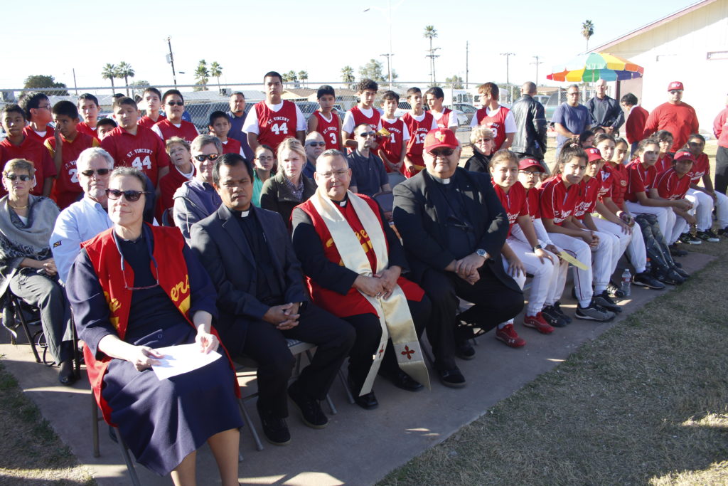 St. Vincent de Paul's baseball and softball teams joined school leaders and Bishop Eduardo A. Nevares for the blessing of their upgraded field Jan. 22. (Ambria Hammel/CATHOLIC SUN)