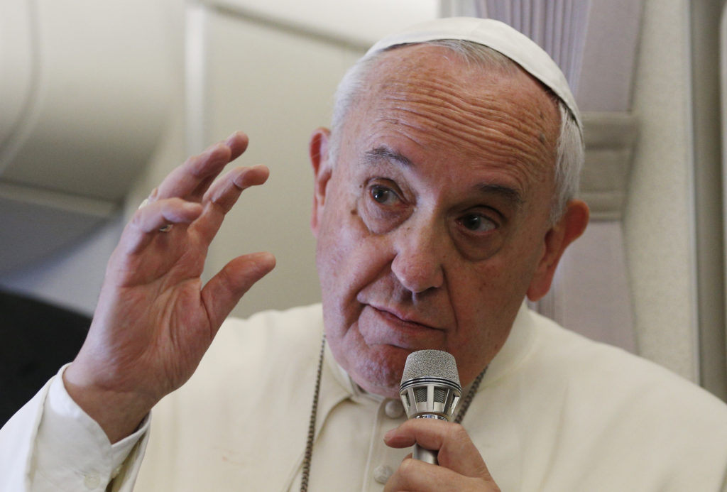 Pope Francis responds to questions about the September U.S. papal visit during a news conference aboard his flight from Manila, Philippines, to Rome Jan. 19. (CNS photo/Paul Haring)  