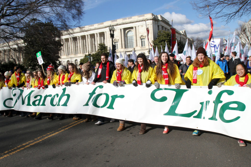Students from Shanley High School in Fargo, N.D., St. Mary's High School in Bismarck, N.D., and Bishop Ryan High School in Minot, N.D., carry the lead banner during the annual March for Life in Washington Jan. 22. Nearly 500 students from North Dakota Catholic schools participated in this year's event. (CNS photo/Gregory A. Shemitz) 