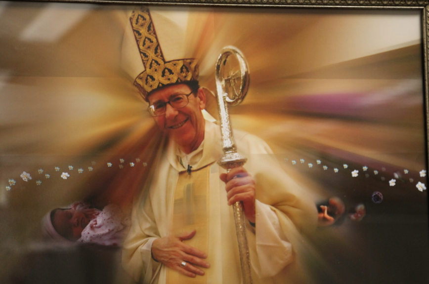 Bishop Thomas J. Olmsted is depicted in a framed photo composition that adorns the walls of the diocesan Office of Respect Life.