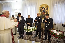 Pope Francis blesses lambs to mark the feast of St. Agnes at the Vatican Jan. 21. The wool from two lambs blessed by the pope will be used to make the palliums the pontiff gives each June to new archbishops from around the world. (CNS photo/L'Osservatore Romano via Reuters) 