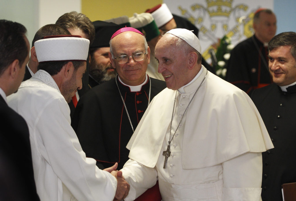Pope Francis greets a Muslim representative during a meeting with leaders of other religions at the Catholic University of Our Lady of Good Counsel in Tirana, Albania, Sept. 21. (CNS photo/Paul Haring)