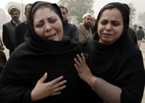 Pakistani women weep during a memorial ceremony Dec. 23, 2014, outside an army-run school in Peshawar, Pakistan, that was attacked by militants. (CNS photo/Ashad Arbab, EPA) 