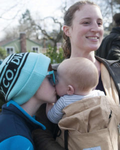 Zen Orion-Orchard, 10, kisses his younger brother, Jackson, Feb. 4 while their mother Melissa Orion looks on. The Ashland, Oregon, mom has declined to vaccinate her children. Measles cases in the U.S. in 2015 have already reached record numbers, putting a spotlight on the debate over some parents' reasons for rejecting immunizations for their children. (CNS photo/Amanda Loman, Reuters)