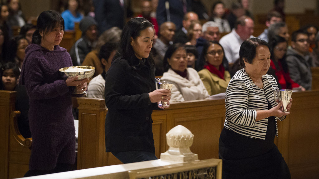 Survivors of human trafficking carry offertory gifts during at Mass celebrated Feb. 8 at the Basilica of the National Shrine of the Immaculate Conception in Washington to mark the International Day of Prayer and Awareness Against Human Trafficking. The Mass was celebrated on the feast of St. Josephine Bakhita, a Sudanese saint who was kidnapped by Arab slave traders in the 1800s. (CNS photo/Tyler Orsburn)  