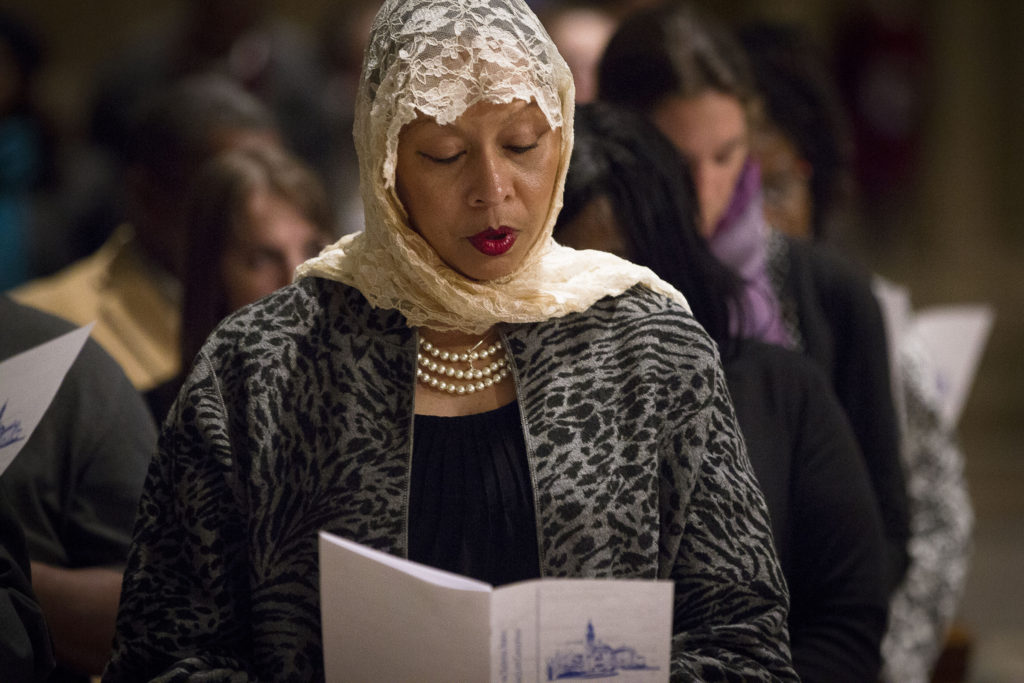 A woman sings during a Mass Feb. 8 to mark the International Day of Prayer and Awareness Against Human Trafficking at the Basilica of the National Shrine of the Immaculate Conception in Washington. The Mass was celebrated on the feast of St. Josephine Bakhita, a Sudanese saint who was kidnapped by Arab slave traders in the 1800s. (CNS photo/Tyler Orsburn) See TRAFFICKING-MASS Feb. 9, 2015.