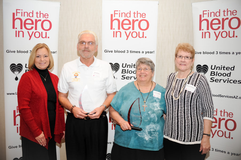 Bill Haman from St. Jerome and Connie Gaudio and Simone Barthell both from St. Clare, accepted the Hero Award on behalf of blood drive coordinators and donors who supported blood drive efforts during 2014. The parishes, alongside Immaculate Conception in Cottonwood, were among 28 groups named in the top three percent of blood drive hosts across Arizona Feb. 13. (courtesy photo)