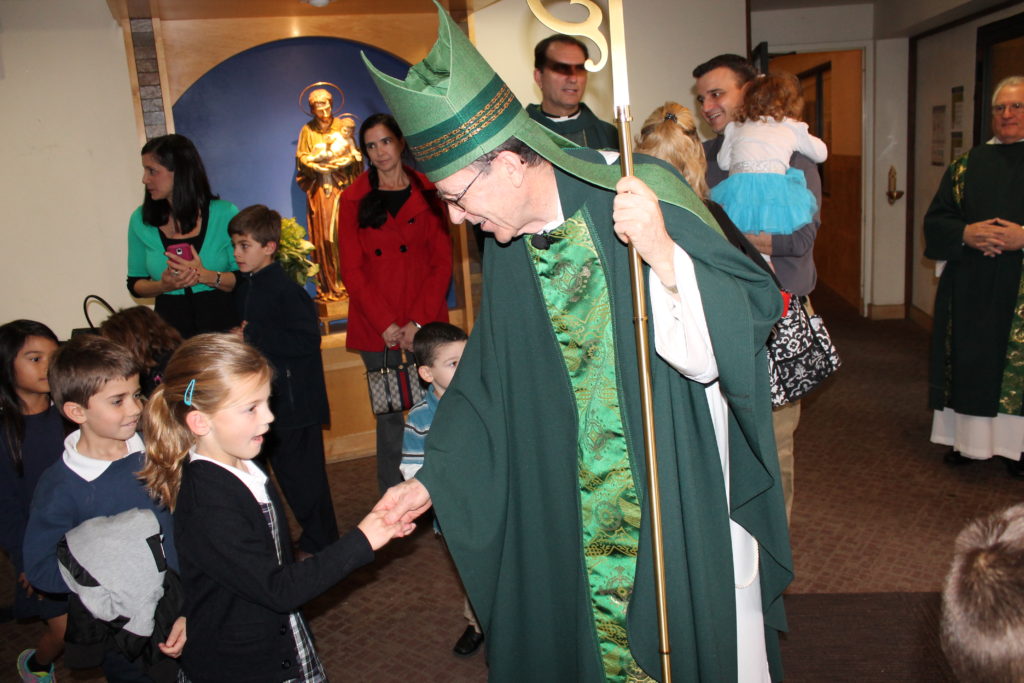 Bishop Olmsted greeted a long line of St. Mary-Basha Cath students after 