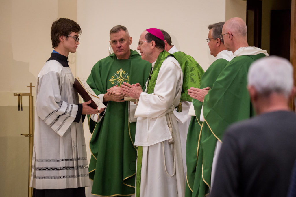 Bishop Thomas J. Olmsted prepared to consecrate the altar with fragrant holy oil in the new worship space at All Saints Catholic Newman Center in Tempe Jan. 24. (Billy Hardiman/CATHOLIC SUN)