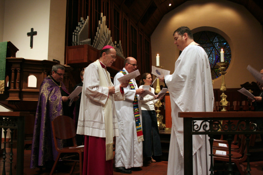 Bishop Olmsted prays alongside clergy from other Christian denominations at Trinity Episcopal Cathedral Jan. 22 during an ecumenical prayer service sponsored by Arizona Faith Network. (Courtesy photo/Episcopal Diocese)