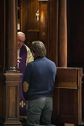 Pope Francis hears confession from a man during a penitential liturgy in St. Peter's Basilica at the Vatican during the 2014 Lenten season. Pope Francis surprised his liturgical adviser by going to confession during the service. (CNS photo/L'Osservatore Romano via Reuters) 