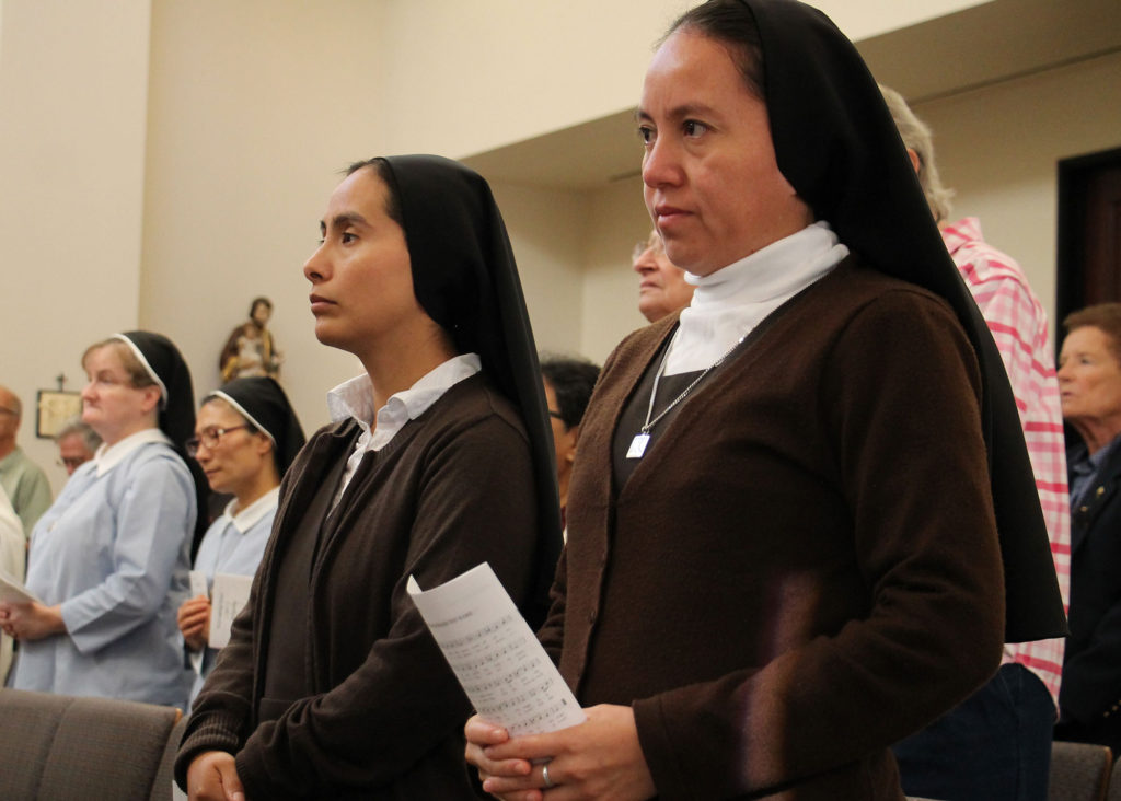 From left: Sr. Mary Eileen Jewell, PVMI, Sr. Mary Beata Im, PVMI, Sr. Leonor Chacón, MCSTNJ and Sr. Gloria González, MCSTNJ, pray during the opening Mass for the Year of Consecrated Life at the Diocesan Pastoral Center Nov. 15, 2014. Consecrated life is a gift to the Church, Bishop Olmsted writes. (Ambria Hammel/CATHOLIC SUN)