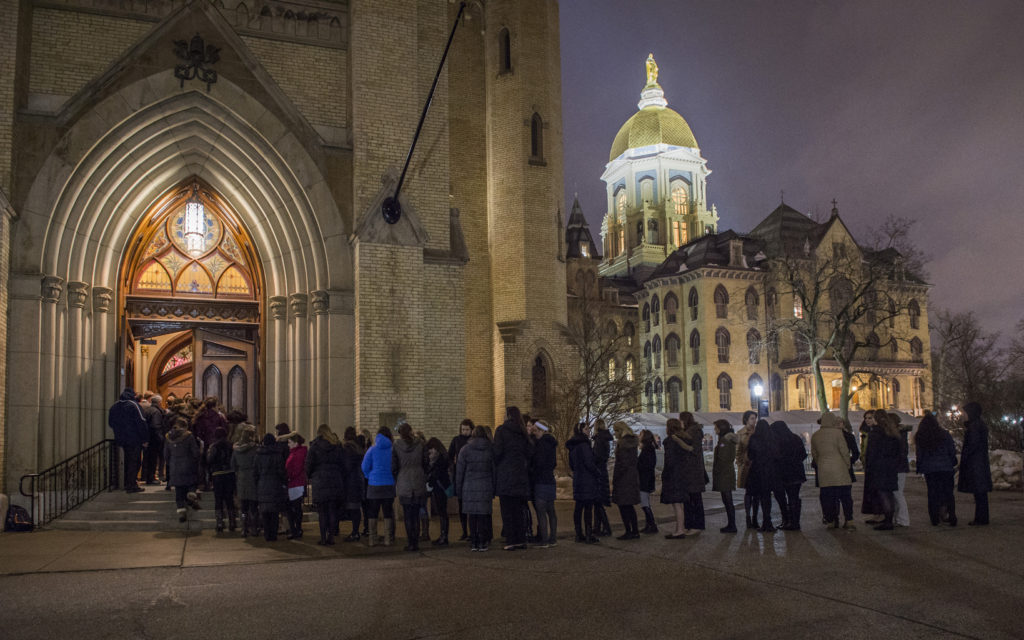 Students wait in line March 3 outside the Basilica of the Sacred Heart on the campus of the University of Notre Dame  to pay their respects at a visitation for Holy Cross Father Theodore Hesburgh, former Notre Dame president. Father Hesburgh died Feb. 26 at age 97 in the Holy Cross House adjacent to the university in Indiana. (CNS photo/Barbara Johnston, University of Notre Dame)