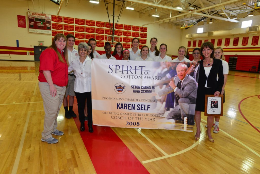 Seton Catholic Girls Varsity Basketball Coach Karen Self, JoAnn Fitzsimmons, wife of Cotton Fitzsimmons, and Phoenix Suns Charities Executive Director Robin Milne with Seton students. (courtesy photo)