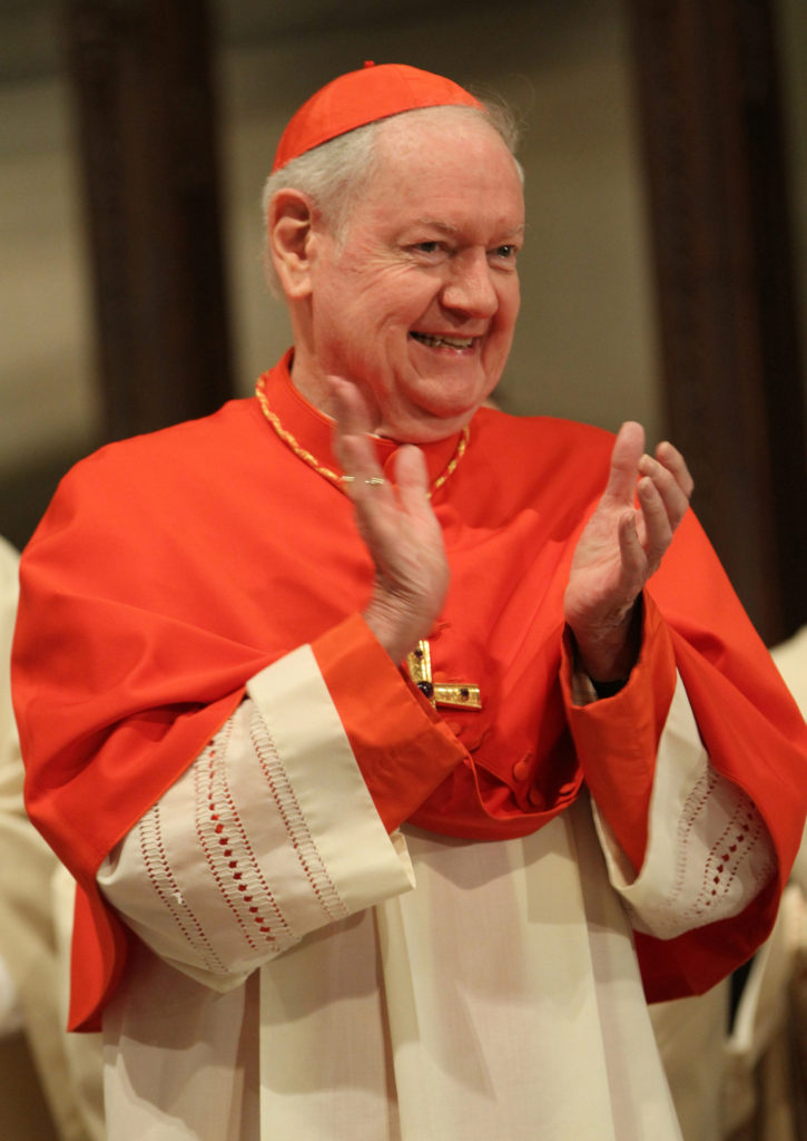 Cardinal Edward M. Egan, retired archbishop of New York, applauds at the beginning of a St. Patrick's Day Mass at St. Patrick's Cathedral in New York in this 2013 file photo. (CNS photo/Gregory A. Shemitz)