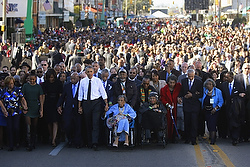 U.S. President Barack Obama and his family participate in a march across the Edmund Pettus Bridge in Selma, Ala., March 7. Demonstrators from across the country sang while retracing the steps of those who marched 50 years ago for civil rights with the Rev. Martin Luther King Jr. over the bridge from Selma to Montgomery, Ala. (CNS photo/Jonathan Ernst, Reuters) 