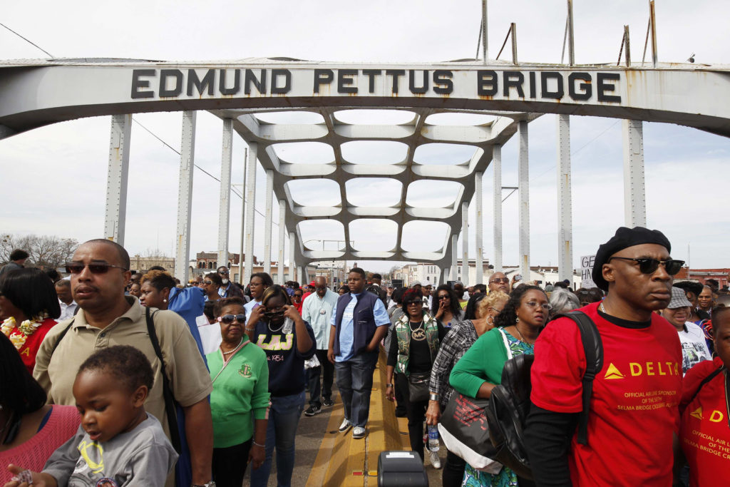 Thousands of people march across the Edmund Pettus Bridge in Selma, Ala., March 8 during a commemoration of the 50th anniversary of the 1965 civil rights march from Selma to Montgomery, the state capital. (CNS photo/Tami Chappell, Reuters) 