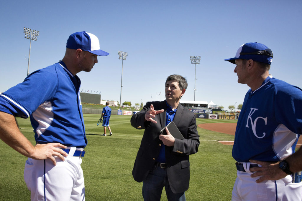 Ray McKenna of Catholic Athletes for Christ talks with Kansas City Royals special assistant Mike Sweeney, right, and relief pitcher Ryan Madson before a spring training game March 10 in Surprise, Arizona. Madson is in the Rite of Christian Initiation program and will join the Catholic Church at Easter. (CNS photo/Nancy Wiechec) 