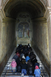 People pray on the Holy Stairs at the Pontifical Sanctuary of the Holy Stairs in Rome March 10. Tradition maintains that Jesus climbed the stairs when Pilate brought him before the crowd. It's believed that Constantine's mother, St. Helen, brought the stairs to Rome from Jerusalem in 326. (CNS photo/Paul Haring)