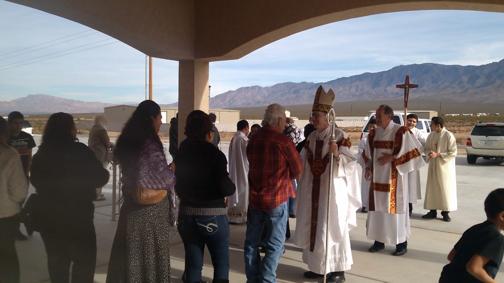 Bishop Thomas J. Olmsted greets La Santisima Trinidad parishioners following a dedication Mass for their new church in December 2014. (Courtesy photo)