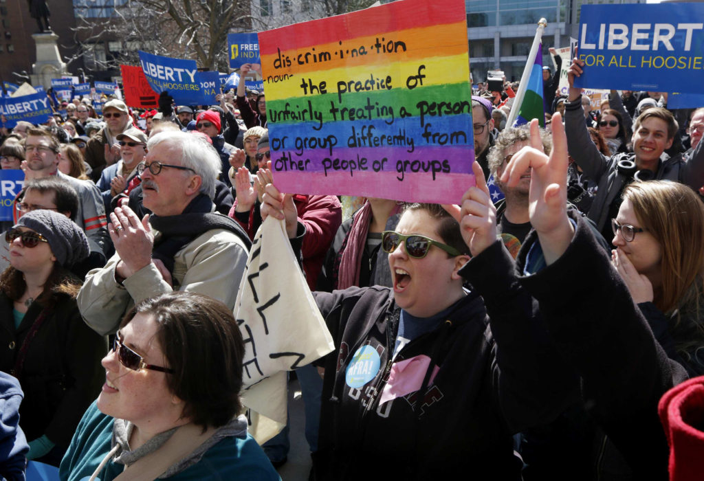 Demonstrators rally at Monument Circle in Indianapolis March 28 to protest a religious freedom bill signed in to law by Indiana Gov. Mike Pence. More than 2,000 people gathered at the state Capitol to protest Indiana's Religious Freedom Restoration Act because they say it would promote discrimination against individuals based on sexual orientation. (CNS photo/Nate Chute, Reuters)