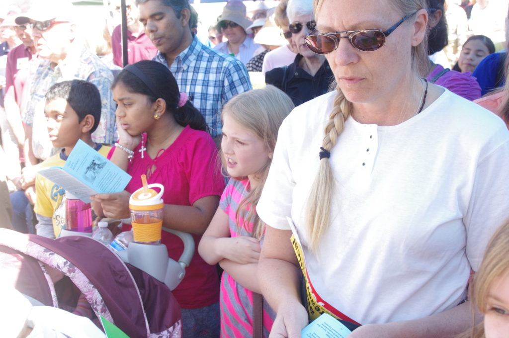 Some 150 Catholics joined together in front of a Planned Parenthood facility to pray the rosary. Bishop Thomas J. Olmsted has led the rosary prayer at an abortion site each year on Good Friday since he arrived to lead the Diocese of Phoenix in 2003. (Joyce Coronel/CATHOLIC SUN)