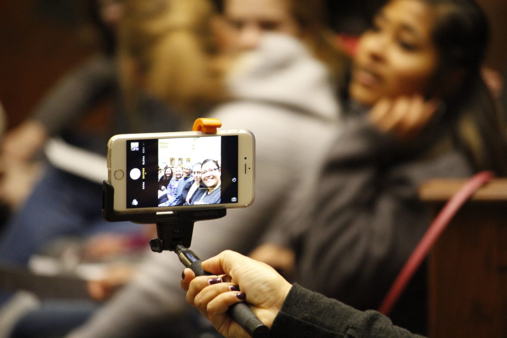 Young adults take a group selfie during the 2015 Rally for Life at All Saints Catholic Newman Center in Tempe Jan. 23. The crowd was encouraged to share about the event on social media using two hashtags, just one way of taking part in the new evangelization. (Ambria Hammel/CATHOLIC SUN)
