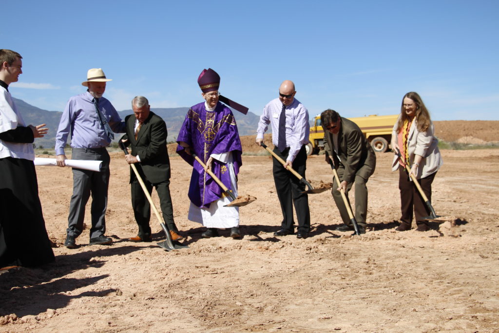 Brent Maupin (engineer) Bob Backus (builder), Bishop Thomas J. Olmsted, Mark Tufti (VP/branch manager, commercial lender Country Bank ) and Cottonwood Mayor Diane Joens turned over the first shovel of dirt at the March 22 ground-breaking for St. Joseph School. (Ambria Hammel/CATHOLIC SUN)