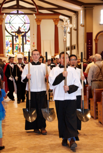 Jake Sweeney, John Paul Hansen, Arom Burgueno and Hayden Smith helped form the procession for the March 22 Mass at Immaculate Conception Parish in Cottonwood prior to the ground-breaking for St. Joseph School.  (Ambria Hammel/CATHOLIC SUN)