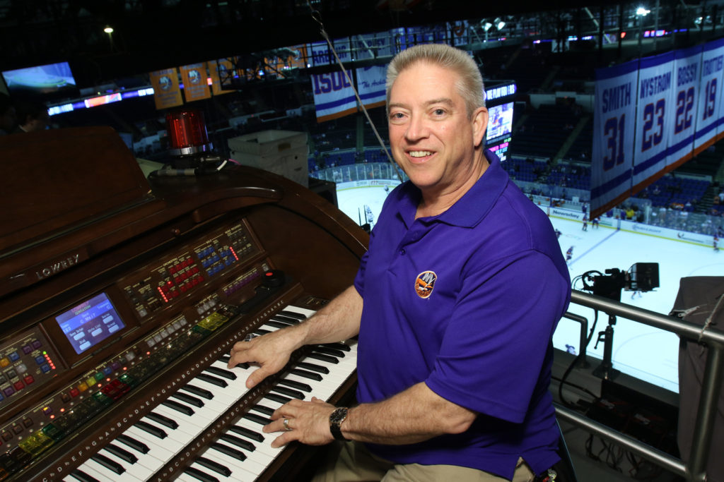 Paul Cartier, organist for the National Hockey League's New York Islanders, poses for a photo before a game at Nassau Veterans Memorial Coliseum in Uniondale, N.Y., March 26. Cartier also plays the organ for Major League Baseball's New York Yankees and at Our Lady of Hope Church in Carle Place, N.Y. (CNS photo/Gregory A. Shemitz)
