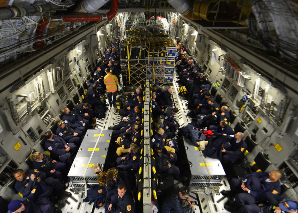 This handout image released April 27 shows sixty-nine members of the Fairfax County Urban Search and Rescue Team awaiting takeoff on a U.S. Air Force plane with approximately 70,000 pounds of equipment and supplies. The plane was headed to Nepal as part of a worldwide relief efforts in response to a devastating earthquake. (CNS photo/Airman first class William Johnston, handout via EPA)