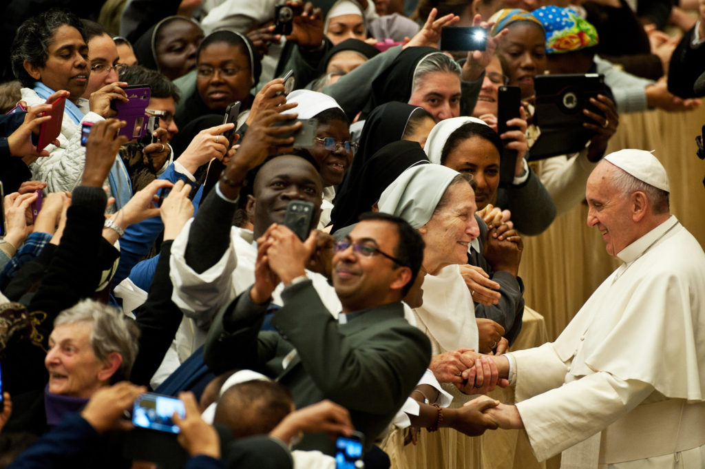 Pope Francis greets nuns and priests during a meeting with participants in an international congress organized by the Congregation for Institutes of Consecrated Life and Societies of Apostolic Life in Paul VI hall at the Vatican April 11. (CNS photo/Massimiliano Migliorato, Catholic Press Photo) 