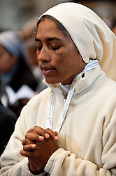 A nun prays during an April 11 Mass in St. Peter's Basilica at the Vatican. The Mass was for participants in an international congress organized by the Congregation for Institutes of Consecrated Life and Societies of Apostolic Life. (CNS photo/Massimiliano Migliorato, Catholic Press Photo)