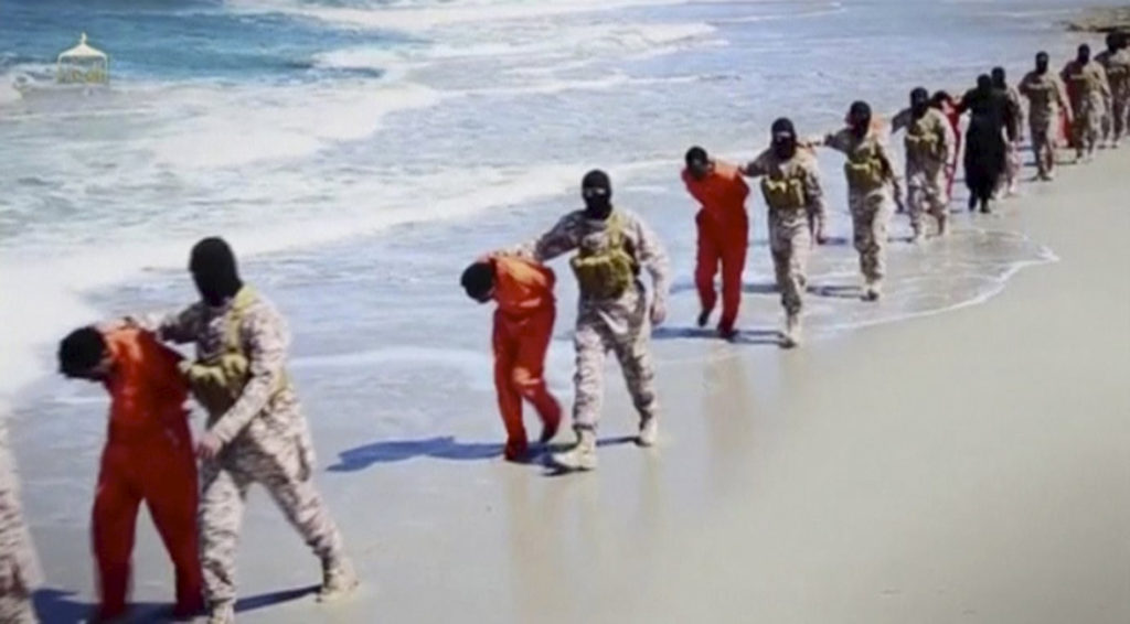 Islamic State militants lead what are said to be Ethiopian Christians along a beach in Libya in this still image from an undated video made available on a social media website April 19. With so many women and men being killed because of their faith in Christ, the church today is a church of martyrs, Pope Francis said in a morning homily. (CNS photo/Social Media Website via Reuters TV) 