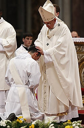 Pope Francis ordains one of 19 new priests in St. Peter's Basilica at the Vatican April 26. In his homily, the pope told the new priests to make sure their homilies were not boring. (CNS photo/Paul Haring)