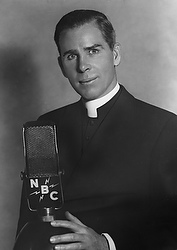 Msgr. Fulton J. Sheen is pictured with an NBC radio microphone in this file photo. In the late 1920s, the priest preached on "The Catholic Hour" radio program and later became its most popular host. He moved to television in the 1950s with "Life is Worth Living." He was named a bishop in 1951 and became archbishop in 1969. (CNS file photo)