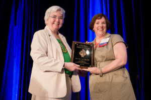 Mercy Sister Mary Ann Walsh, director of media relations for the U.S. Conference of Catholic Bishops, receives the President's Medallion from Sally Oberski of the Catholic Academy of Communication Professionals June 21at the 2013 Catholic Media Conference in Denver. The medallion is the highest membership honor given by the academy. (CNS photo/Jeffrey Bruno) 